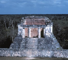 The interior of the structure at the northern end of the Ballcourt is sculpted in bas relief. Red paint remains. Viewing from the Temple of the Jaguars.