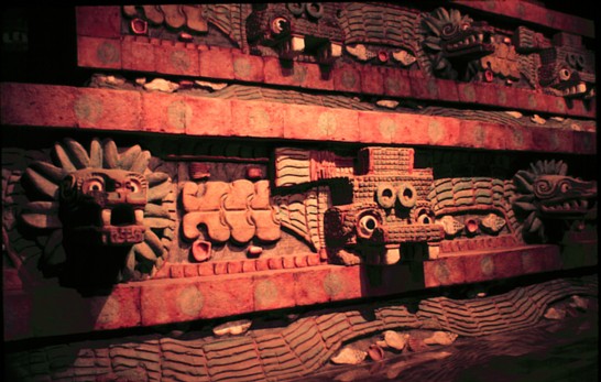 Quetzalcoatl pyramid facade with tlaloc and serpent masks.